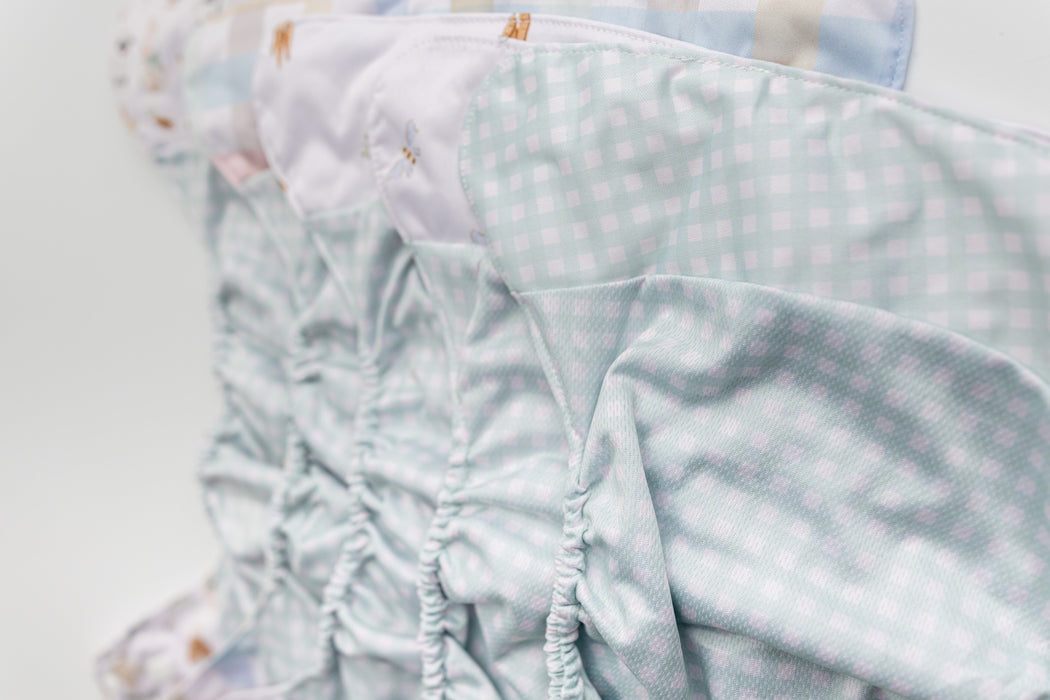 Abstract: Essentials Pocket Cloth Diaper with Athletic Wicking Jersey, Grows with your Baby
